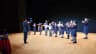 Young string players from Strings Camerata performing on stage