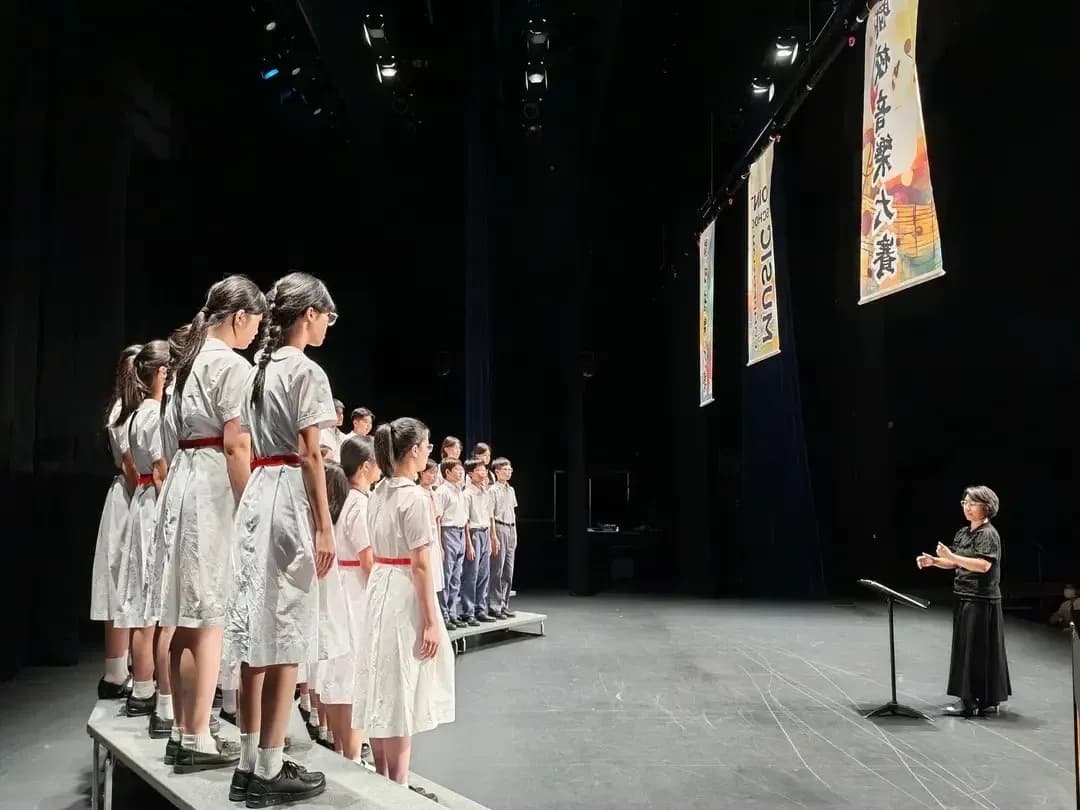 A school choir performing on stage in Hong Kong