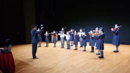 Young string players from Strings Camerata performing on stage